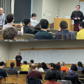 Riley Mangan taking questions with discussions