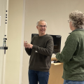 Sean Eddy chatting with Tom Jones before his talk